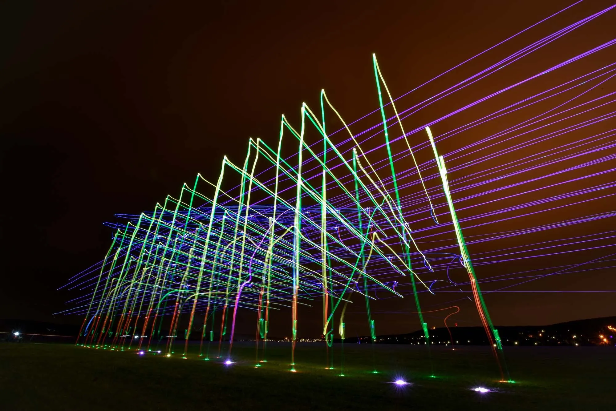 Light painting drone show — long exposure trails of luminous drones